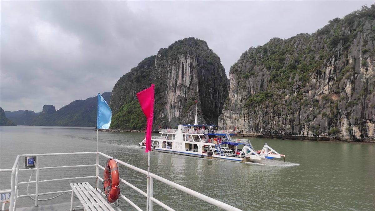 Ferry departing Cat Ba Island harbor for mainland connection