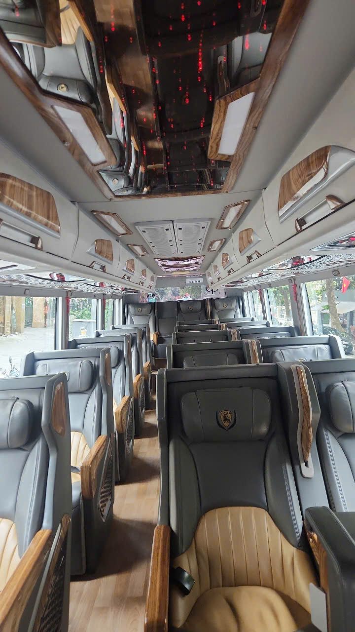 DCAR limousine front view with Ha Long Bay karst mountains