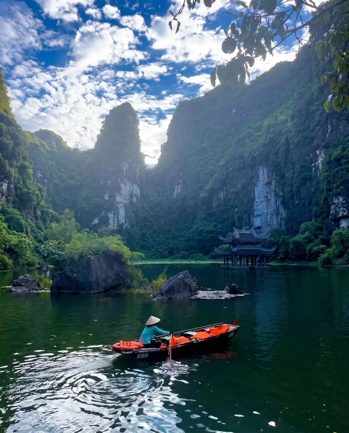 Trang An Ninh Binh sampan boat tour through limestone karst caves UNESCO heritage site