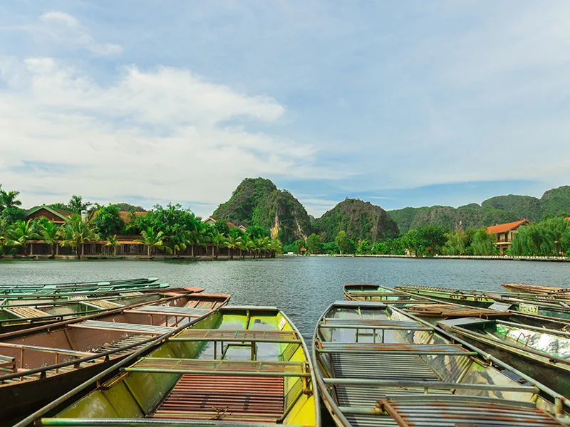Ninh Binh Day Trip from Hanoi 2026: 5 Perfect Itineraries with Timing & Costs Boat dock with karst mountain view, Ninh Binh day tour
