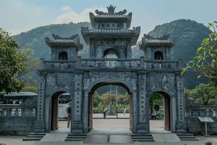 Temple gate at Thai Vi Temple with mountain backdrop, Ninh Binh